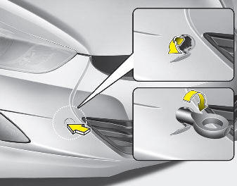Hyundai Elantra: Removable towing hook (if equipped). 1. Open the trunk lid, and remove the towing hook from the tool case.