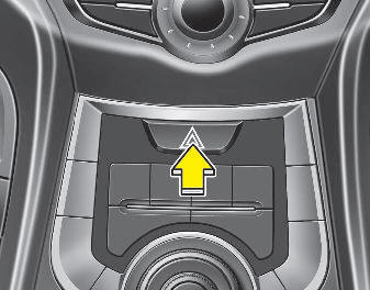 Hyundai Elantra: Hazard warning flasher. The hazard warning flasher should be used whenever you find it necessary to stop