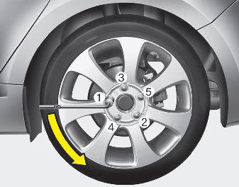 Hyundai Elantra: Changing tires. 7. Loosen the wheel lug nuts counterclockwise one turn each, but do not remove
